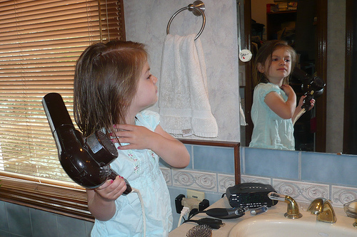Alana drying her hair for special luncheon