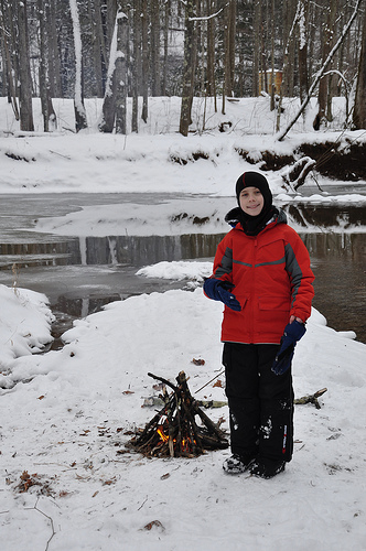 Benton down by the river with a fire