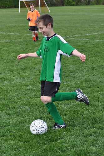 "Giggles" dribbles the soccer ball