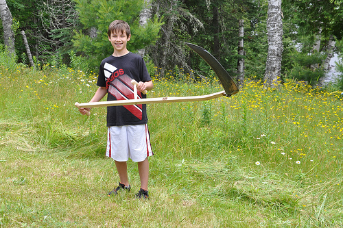 Benton with a scythe