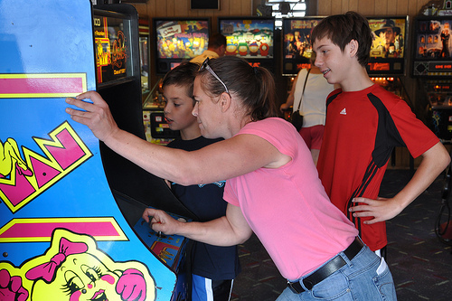 Julie demonstrates her Ms. Pac-Man prowess